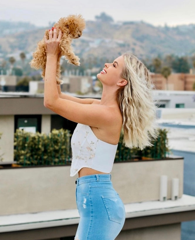 Happy customer holding a teacup red poodle on a rooftop – Velydog Teacup Puppies